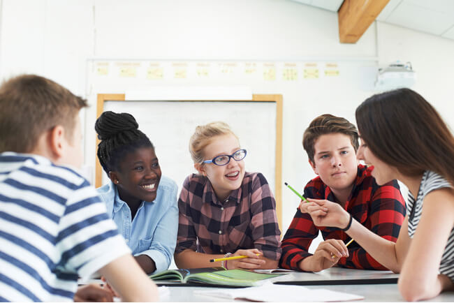 Students in a public charter school work on a project based learning project.